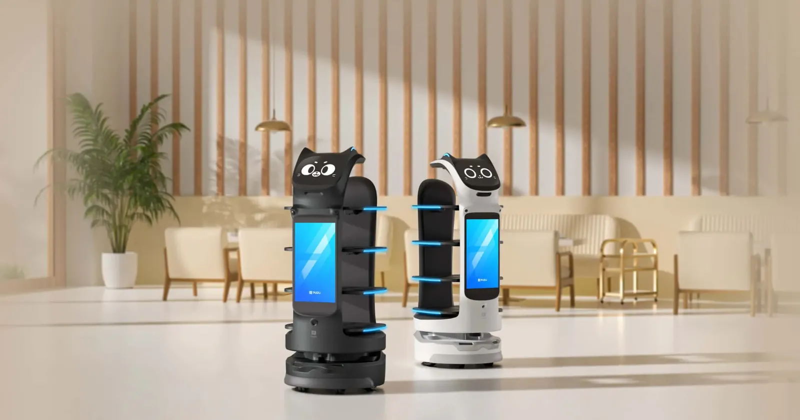 Dos robots de reparto BellaBot Pro, negro y blanco, en un salón elegante de restaurante u hotel